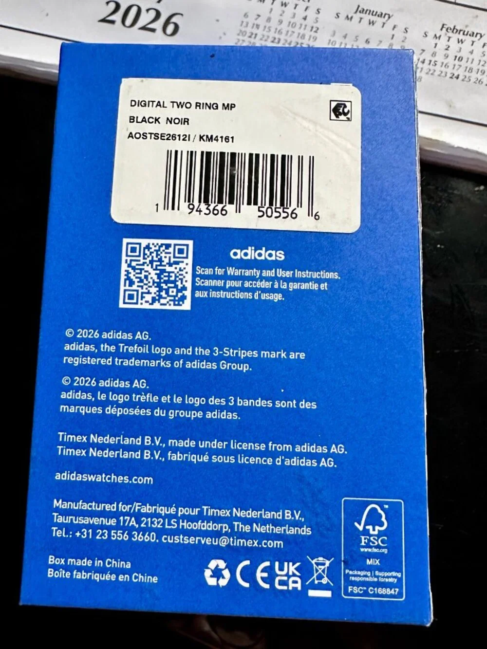 Black Adidas Originals digital two ring watch for finger